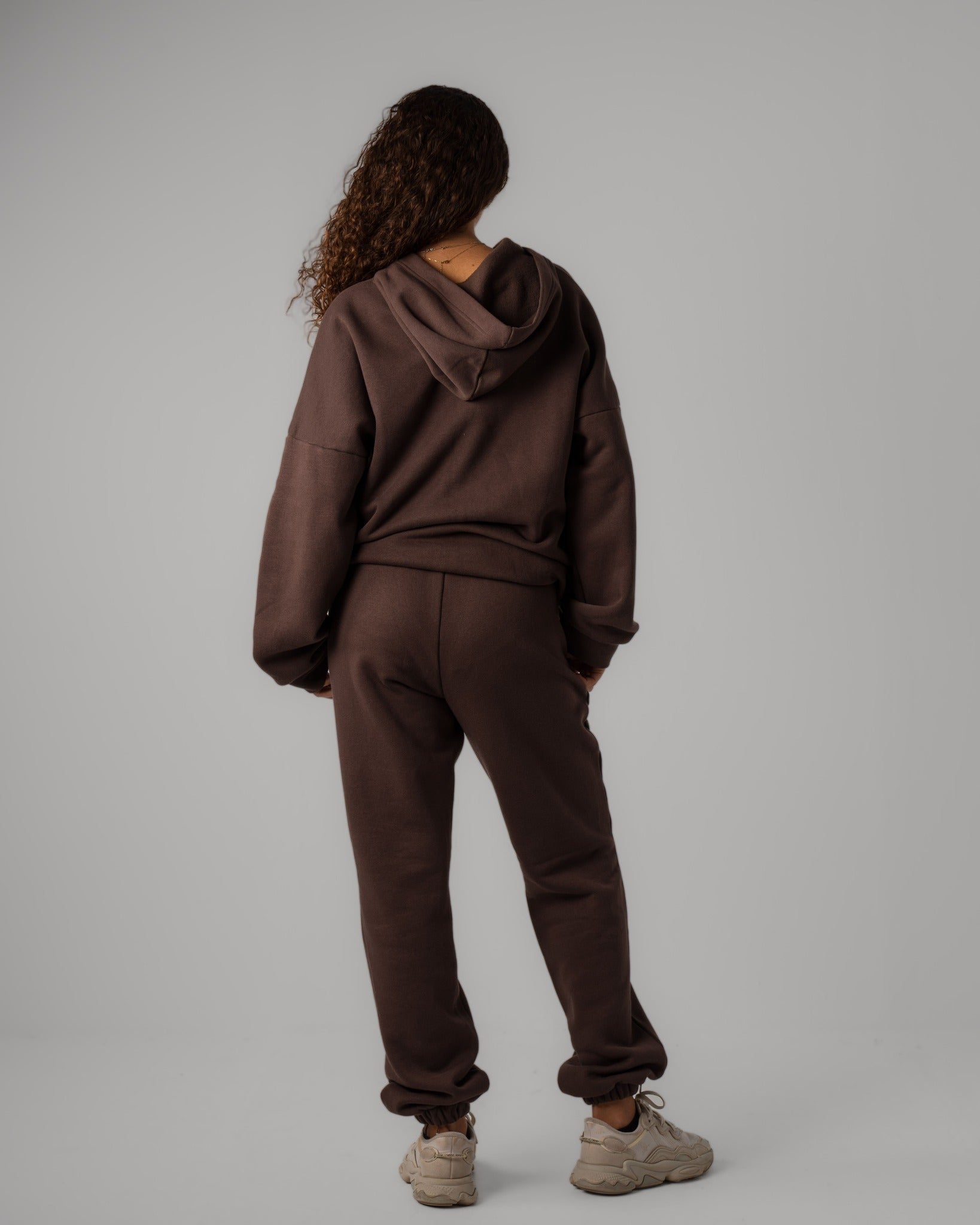 Matching set of brown Hoodie and Cuffed Jogger back view